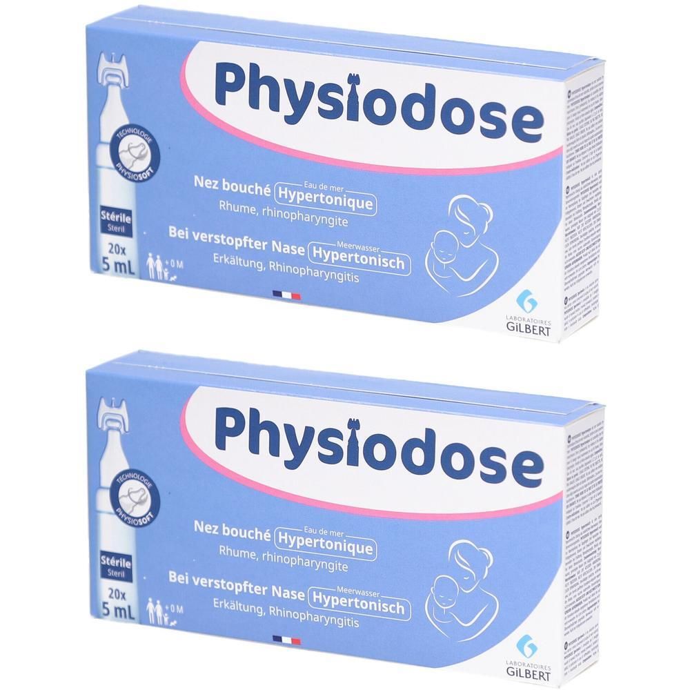Drie witte stoffen maskers met elastiekjes voor de oren.