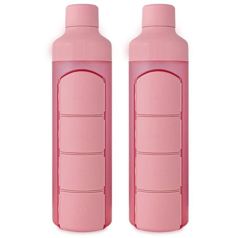 Twee roze waterflessen met ingebouwde dagelijkse pillendoosjes.