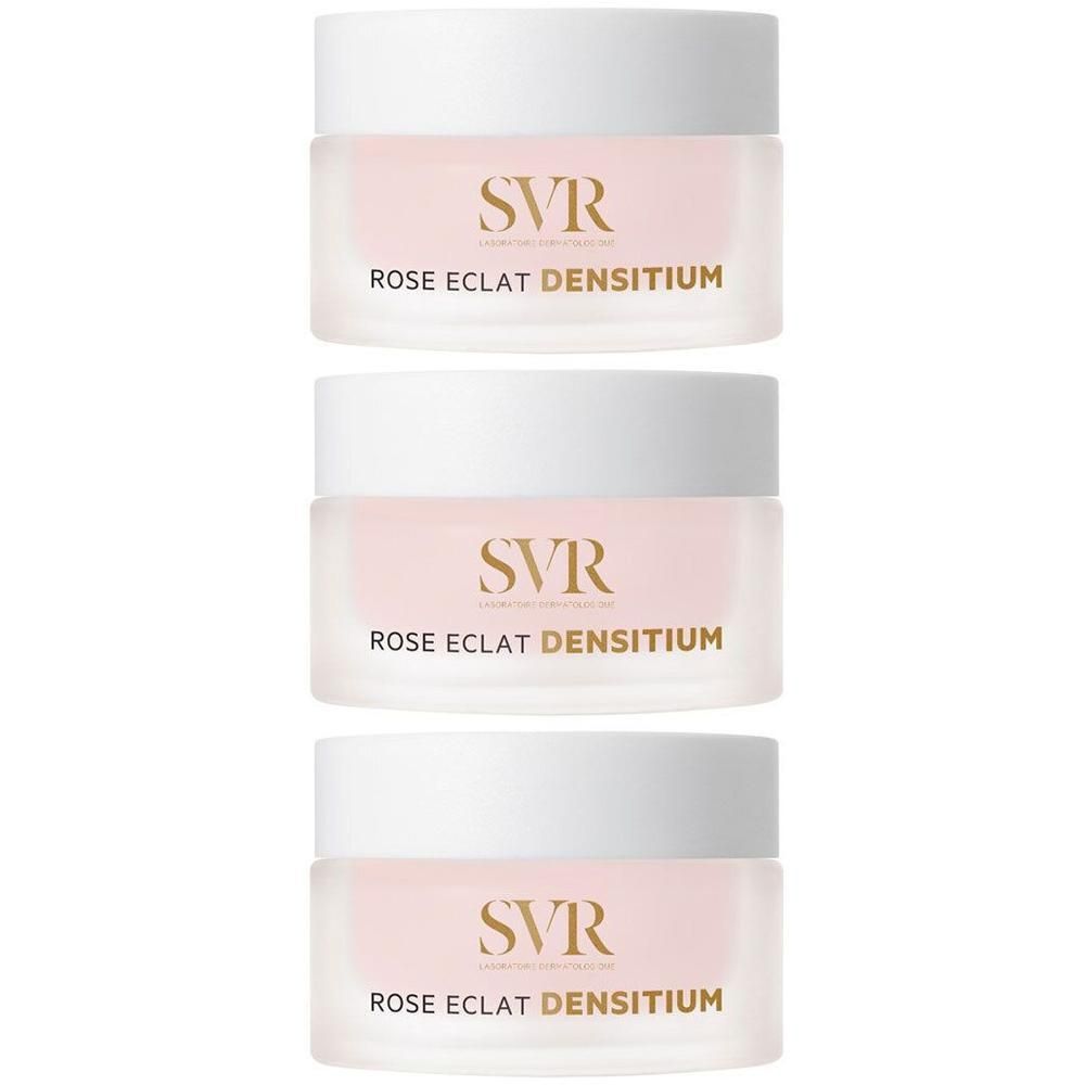 Drie SVR Densitium Rose Éclat crèmepotjes met witte deksels en roze inhoud.