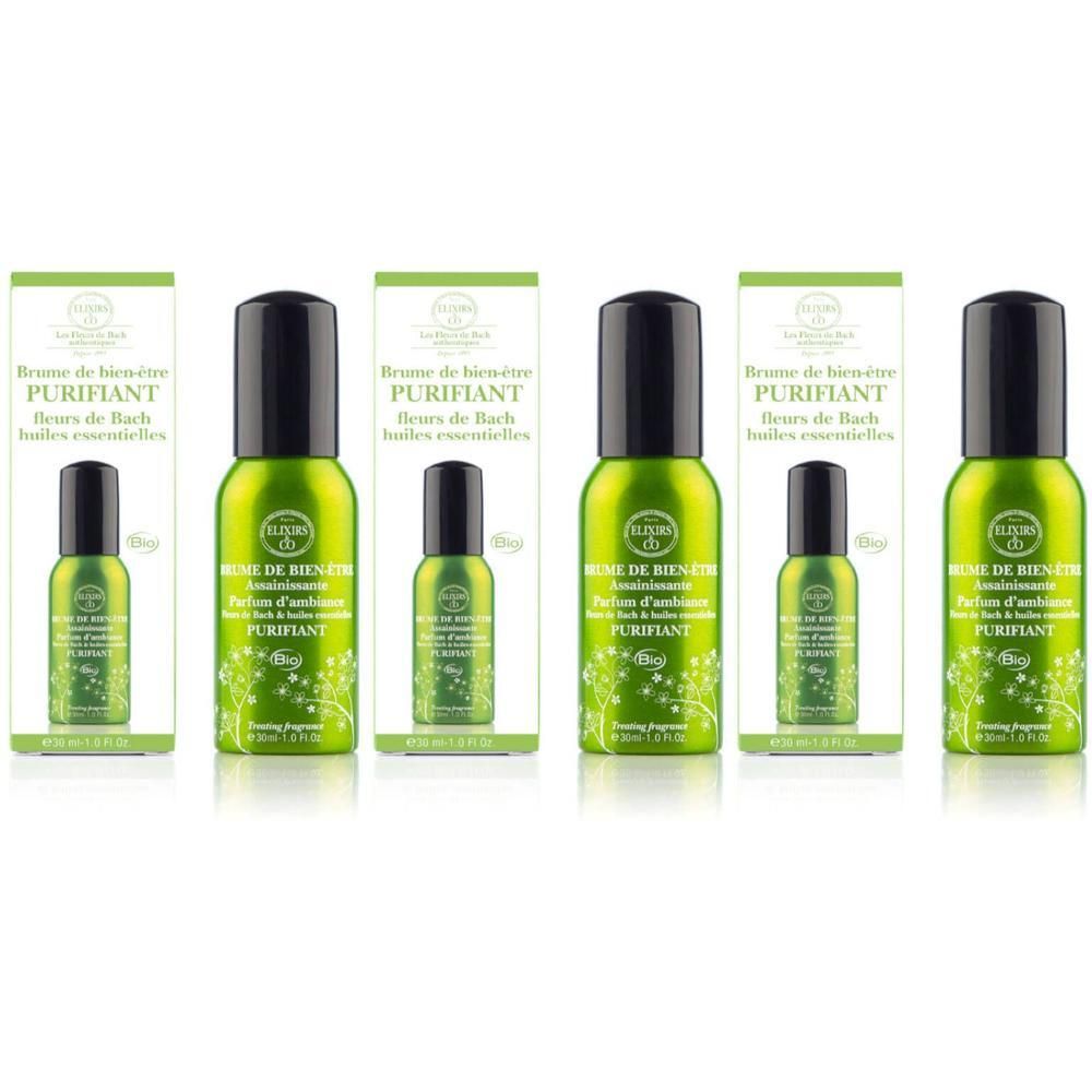 Vijf groene spuitflessen met zwarte dop, verpakt in dozen. Decoratieve groene patronen op flessen en dozen.