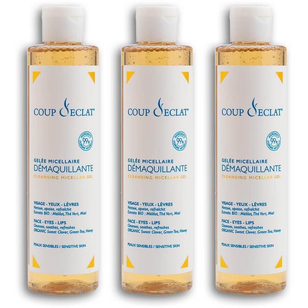 Drie flessen Coup d'Éclat Gelée Micellaire Démaquillante met gele vloeistof en witte dop.