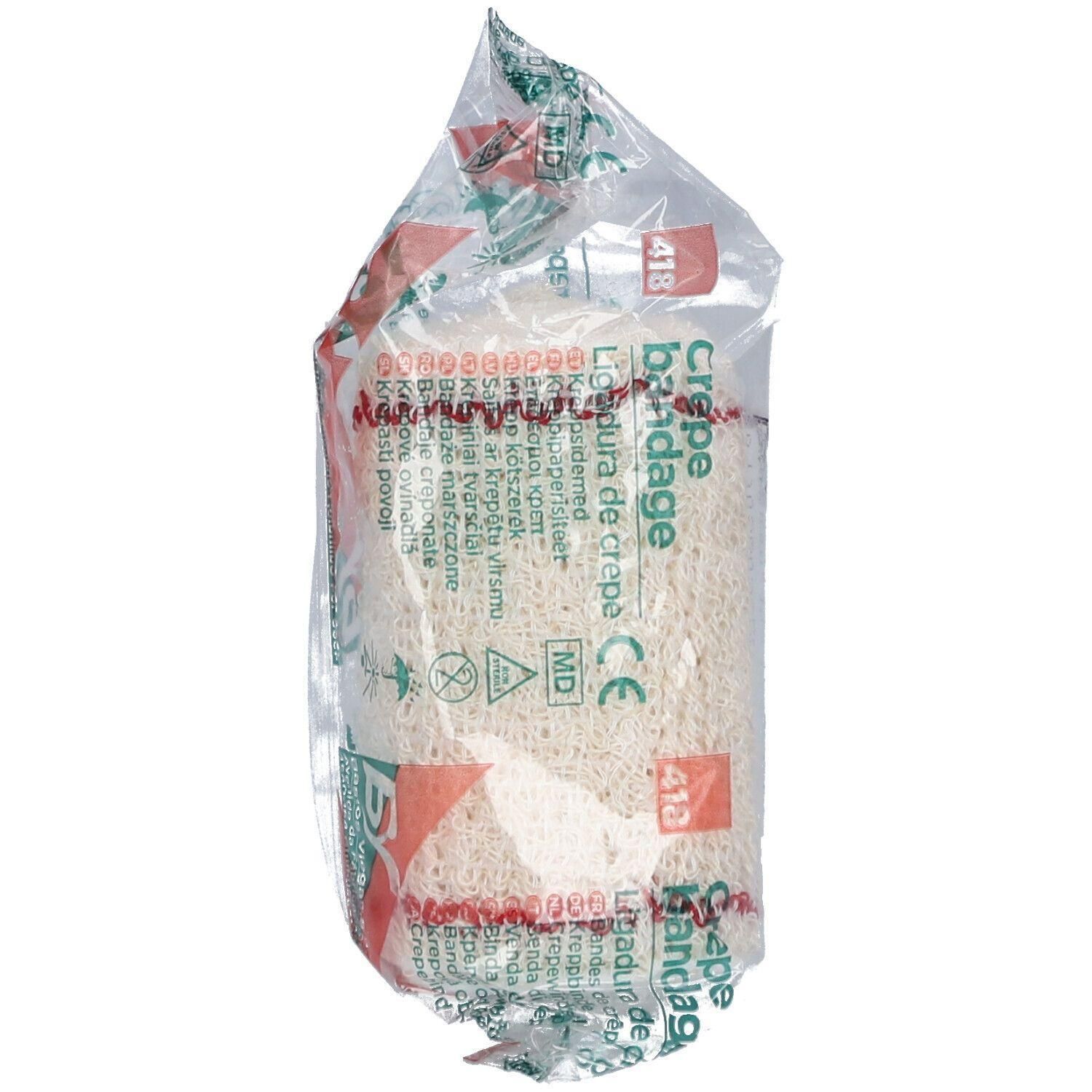 Verpakte crêpe zwachtel, wit, met rode en groene markeringen. CE en MD zegels zichtbaar.