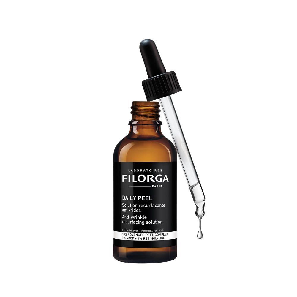 Flacon Filorga DAILY PEEL avec pipette, une goutte tombe.