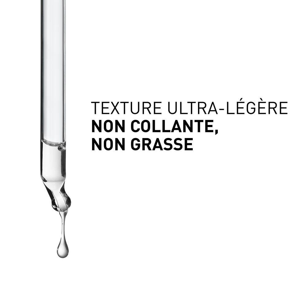 Pipette avec une goutte, texte sur la texture légère.