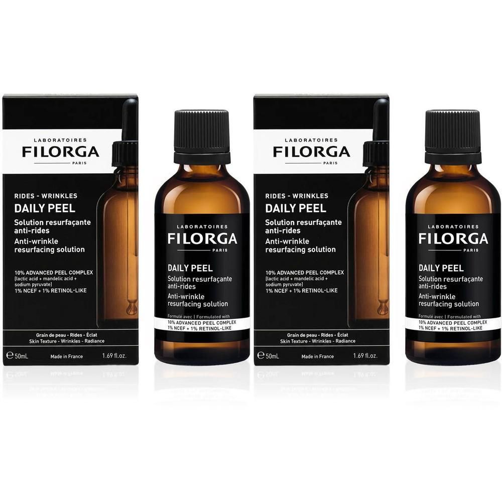 Drie flacons Filorga Daily Peel met pipetten en verpakkingen.