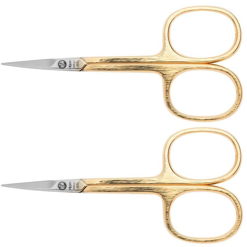 Deux ciseaux à ongles dorés avec lames argentées et poignées texturées.