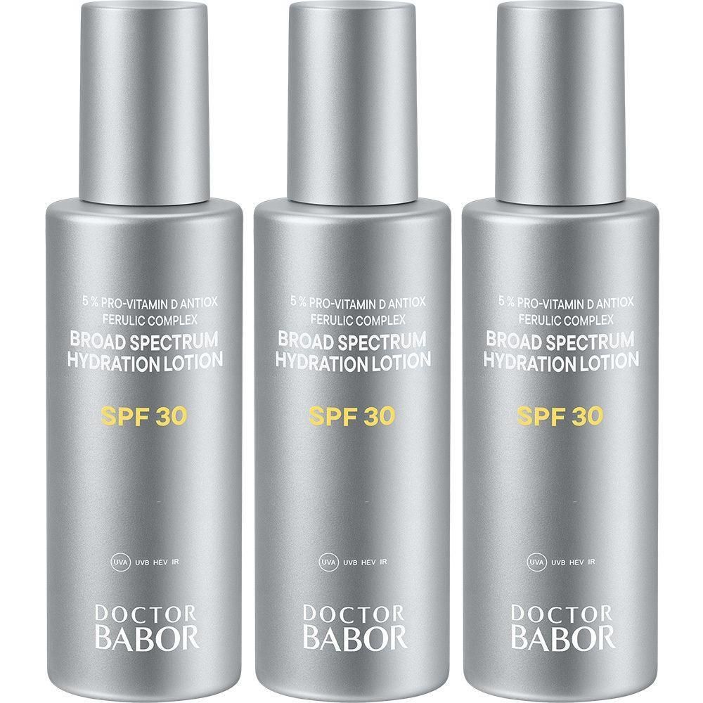 Trois flacons argentés de Lotion hydratante haute protection SPF 30 Babor.
