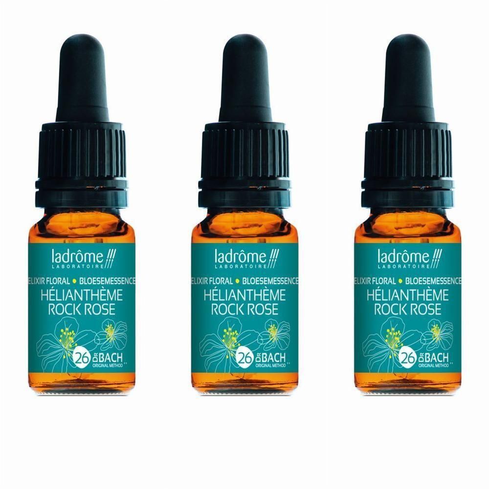 Trois flacons avec bouchon compte-gouttes, contenant un liquide orangé. Étiquettes vertes avec motif floral et informations produit.