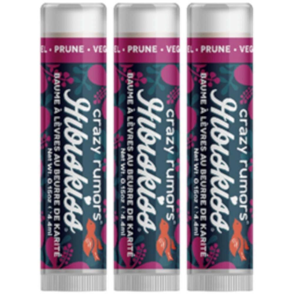 Drie Hibiskiss Prune lippenbalsemstiften met bloemenprint.