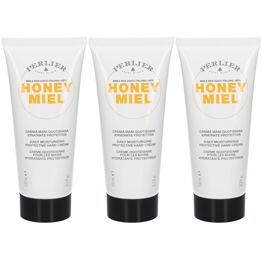 Drie tubes Perlier handcrème met Honey Miel opschrift. Witte tubes met zwarte dop.