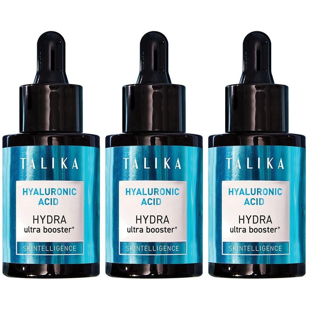 Trois flacons de TALIKA Hydra Ultra Booster Acide Hyaluronique avec pipettes. Étiquettes bleues avec texte blanc.