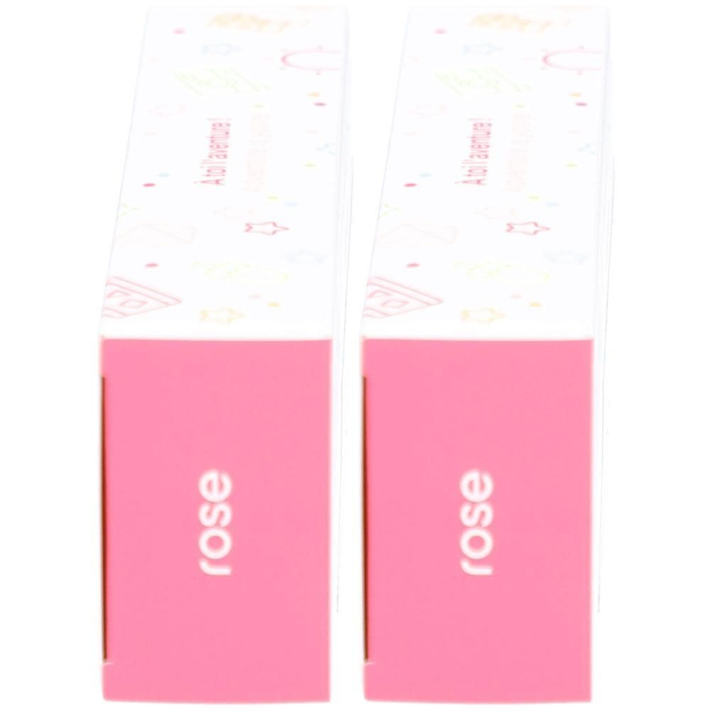 Deux étuis à brosses à dents roses avec couvercle blanc et motif.