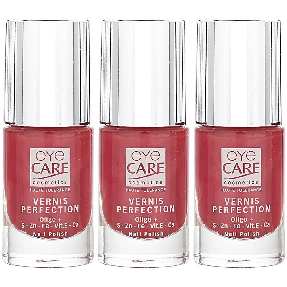 Trois flacons de vernis à ongles rouge Eye Care avec bouchons argentés.