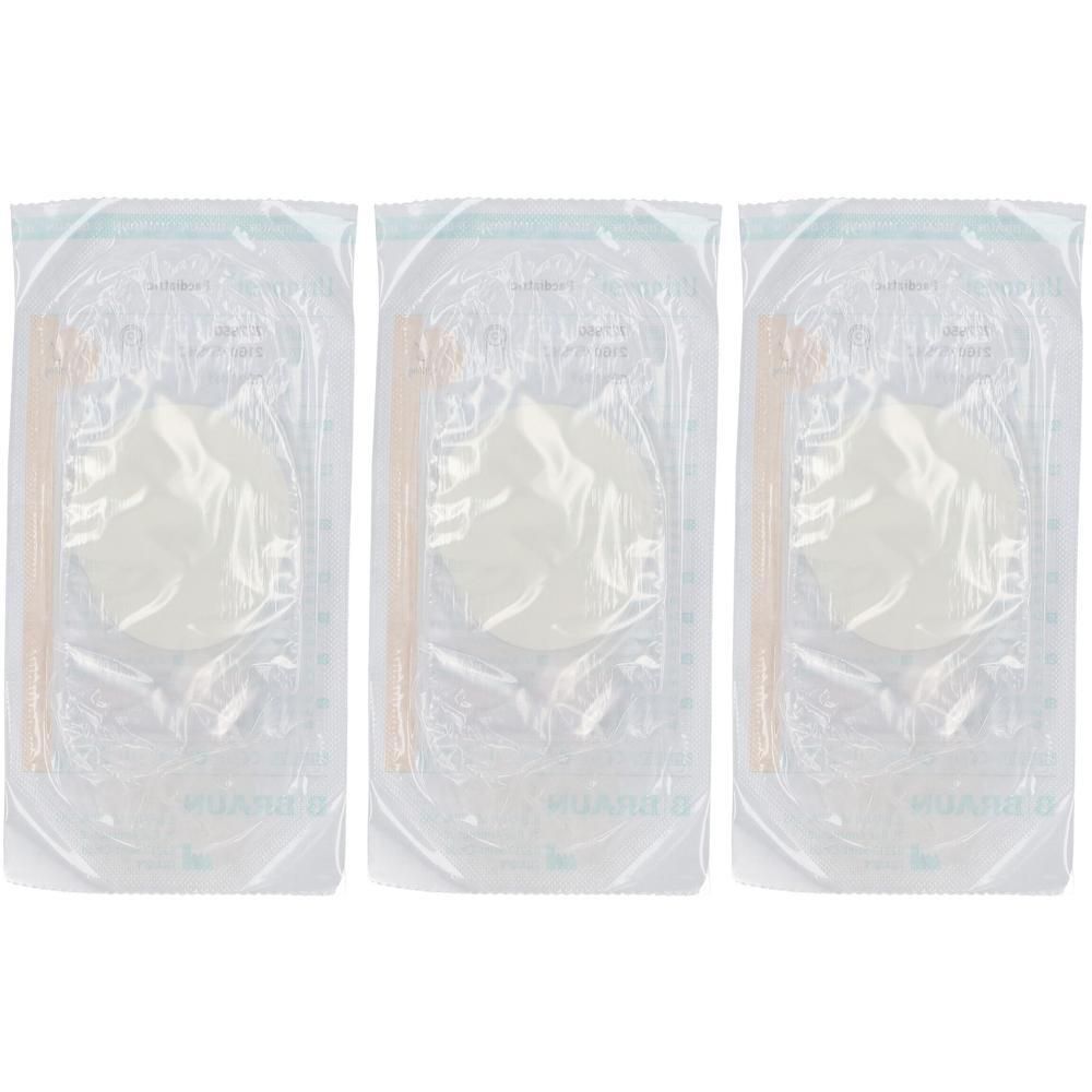 Drie individueel verpakte, ronde, witte pads met een oranje applicator.