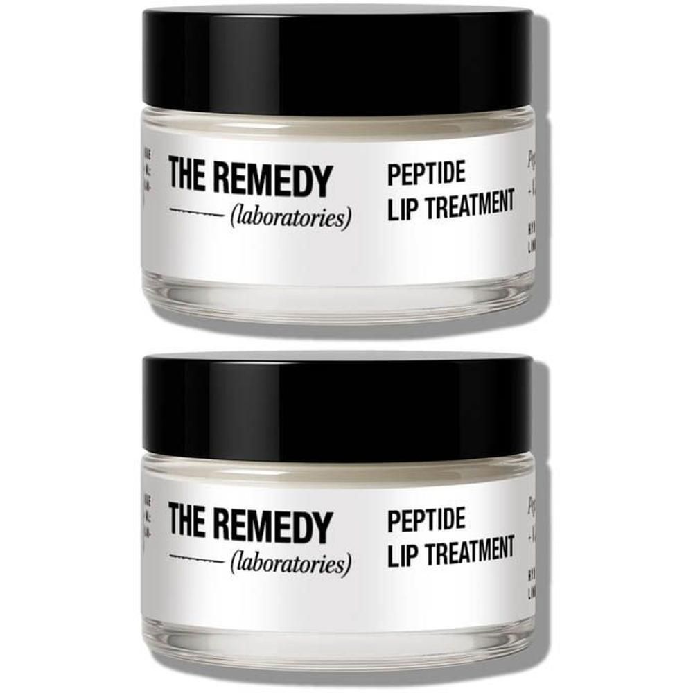 Twee glazen potjes met zwarte deksel, gelabeld "THE REMEDY PEPTIDE LIP TREATMENT".