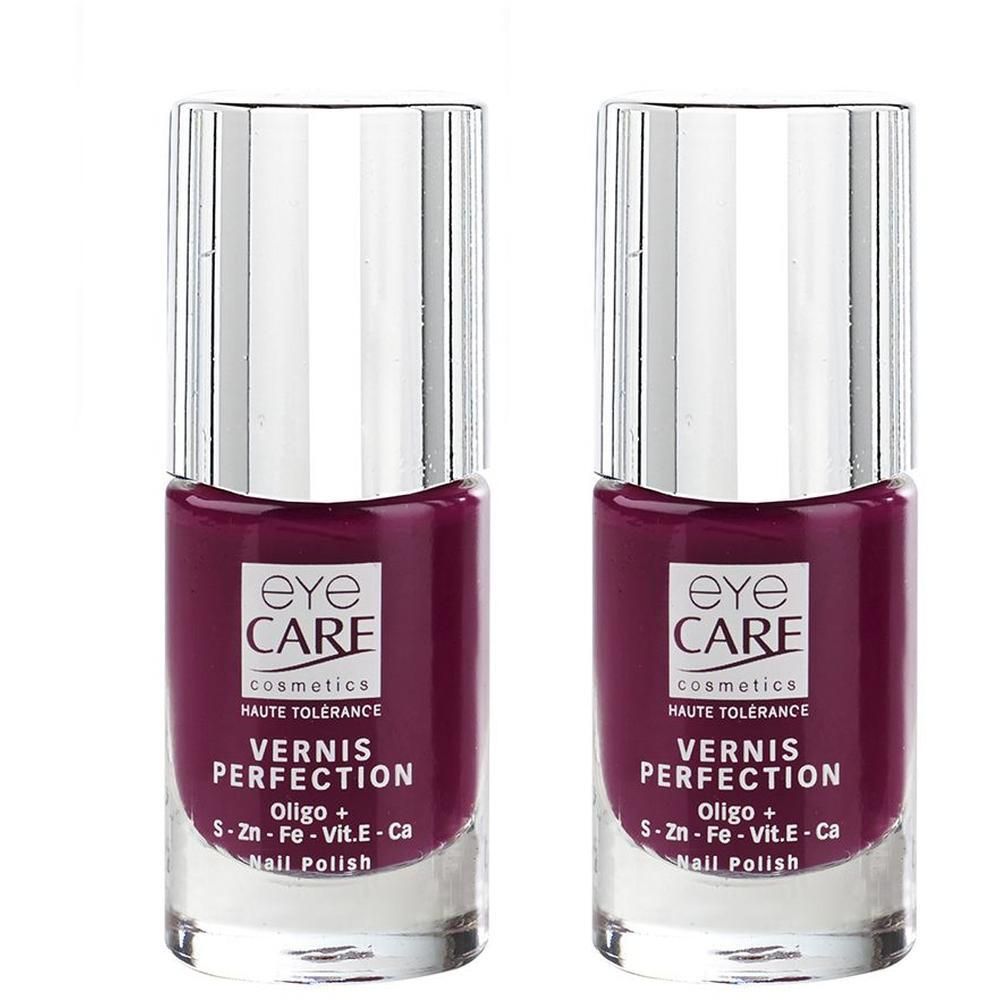 Deux flacons de vernis à ongles rouge foncé Eye Care avec bouchons argentés. Étiquette 'Vernis Perfection'.
