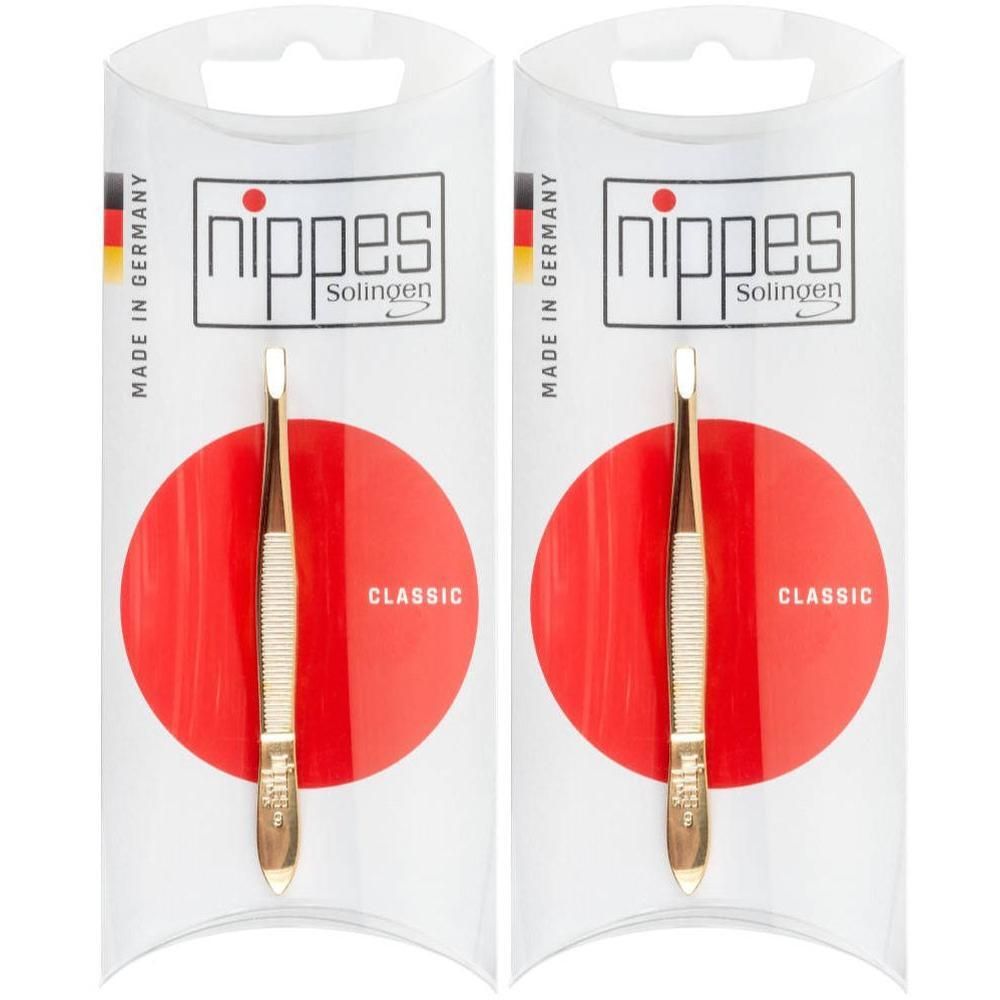 Twee goudkleurige pincetten, klassiek design, verpakt in individuele verpakkingen met rode cirkels. Gemaakt in Duitsland.