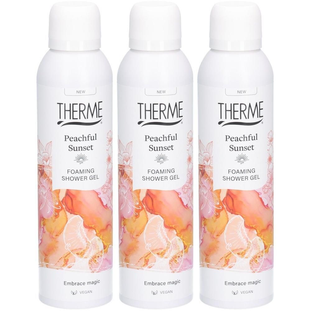 Trois flacons de gel douche moussant Therme Peachful Sunset avec motif pêche et floral.