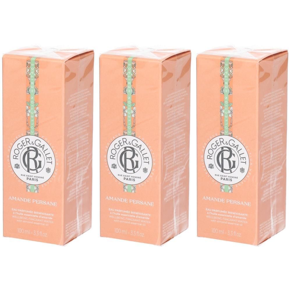 Trois boîtes Roger & Gallet Eau de Parfum Amande Persane, couleur pêche, avec logo et nom du produit.