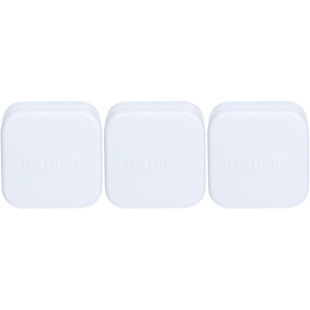Drie witte containers met Babor-logo.