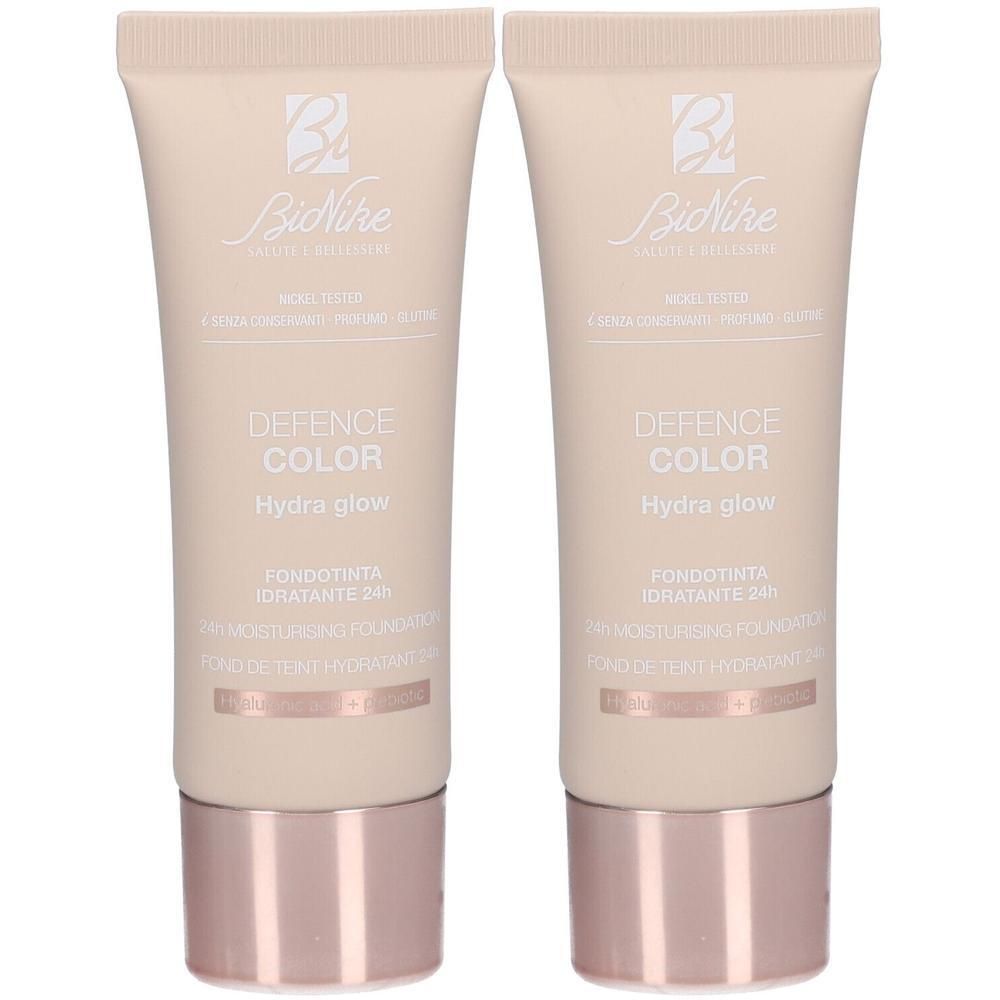 Deux tubes de fond de teint BioNike Defence Color Hydra Glow, teinte 104 Beige.