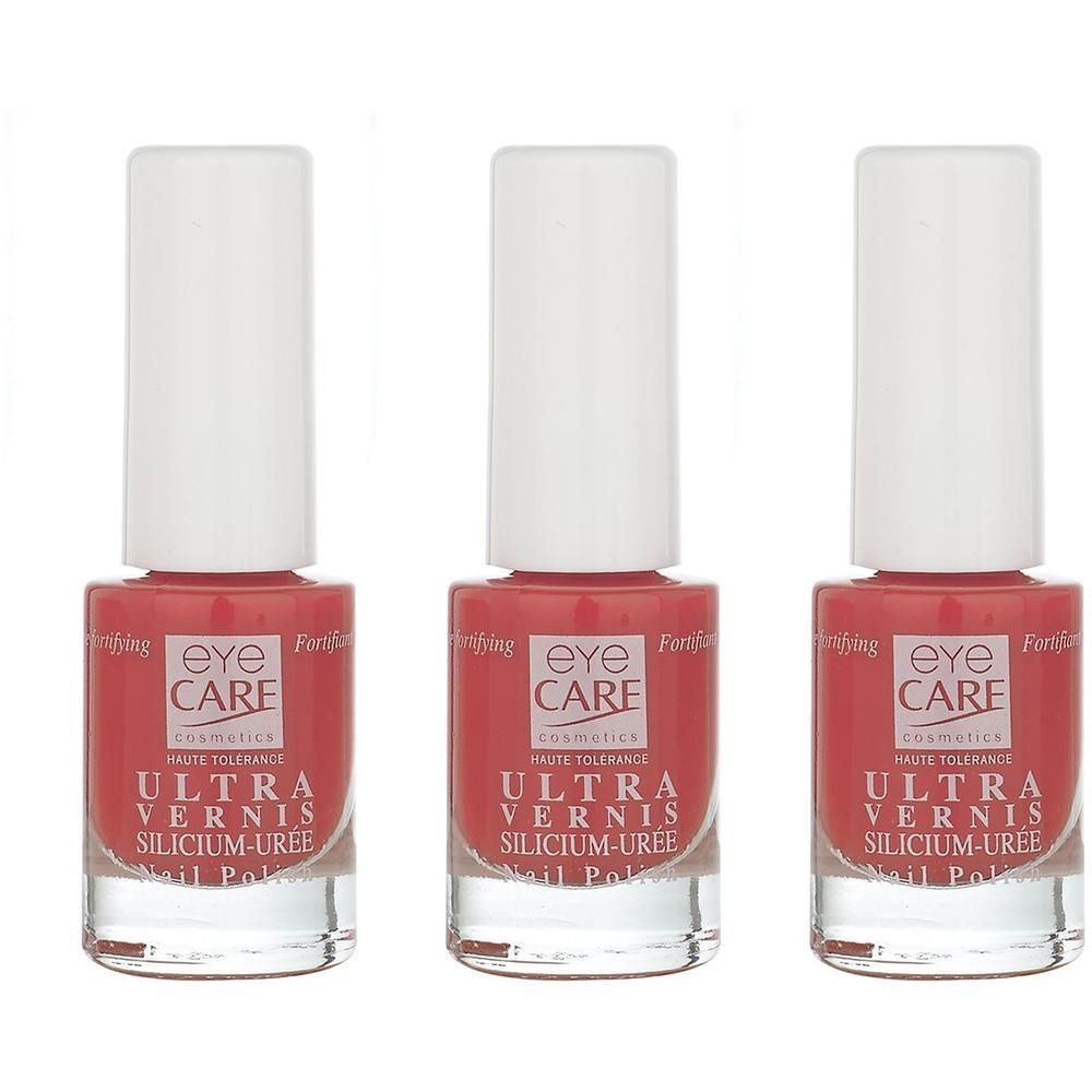 Drie flessen Eye Care Ultra Vernis nagellak in roze. Transparante glazen flesjes met witte doppen.
