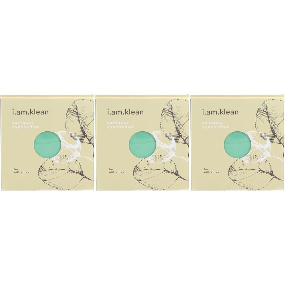 Drie i.am.klean Compact Mineral Eyeshadows "Breezy" met groene cirkels op beige karton met bladtekeningen.