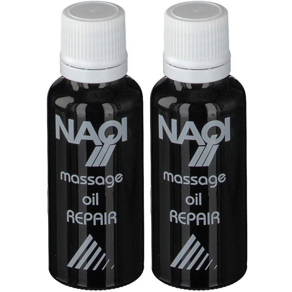 Deux flacons noirs de NAQI Massage Oil Repair avec bouchons blancs.