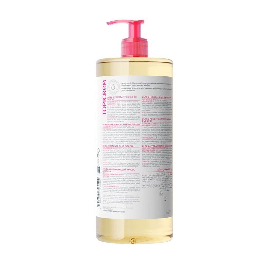 Arrière d'un flacon d'Huile de Douche Topicrem Ultra Hydratant avec informations détaillées sur le produit et instructions d'utilisation multilingues.