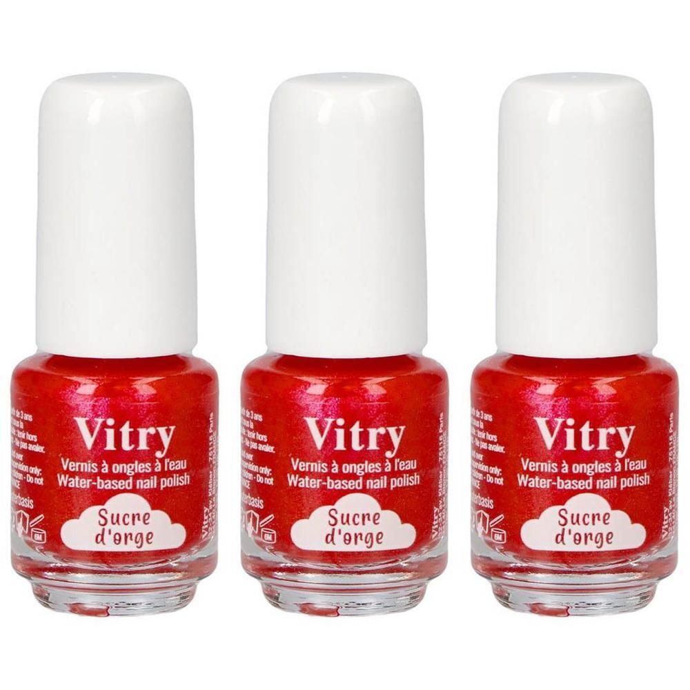 Drie flesjes rode nagellak met witte dopjes. Merk Vitry, variant Sucre d'Orge.