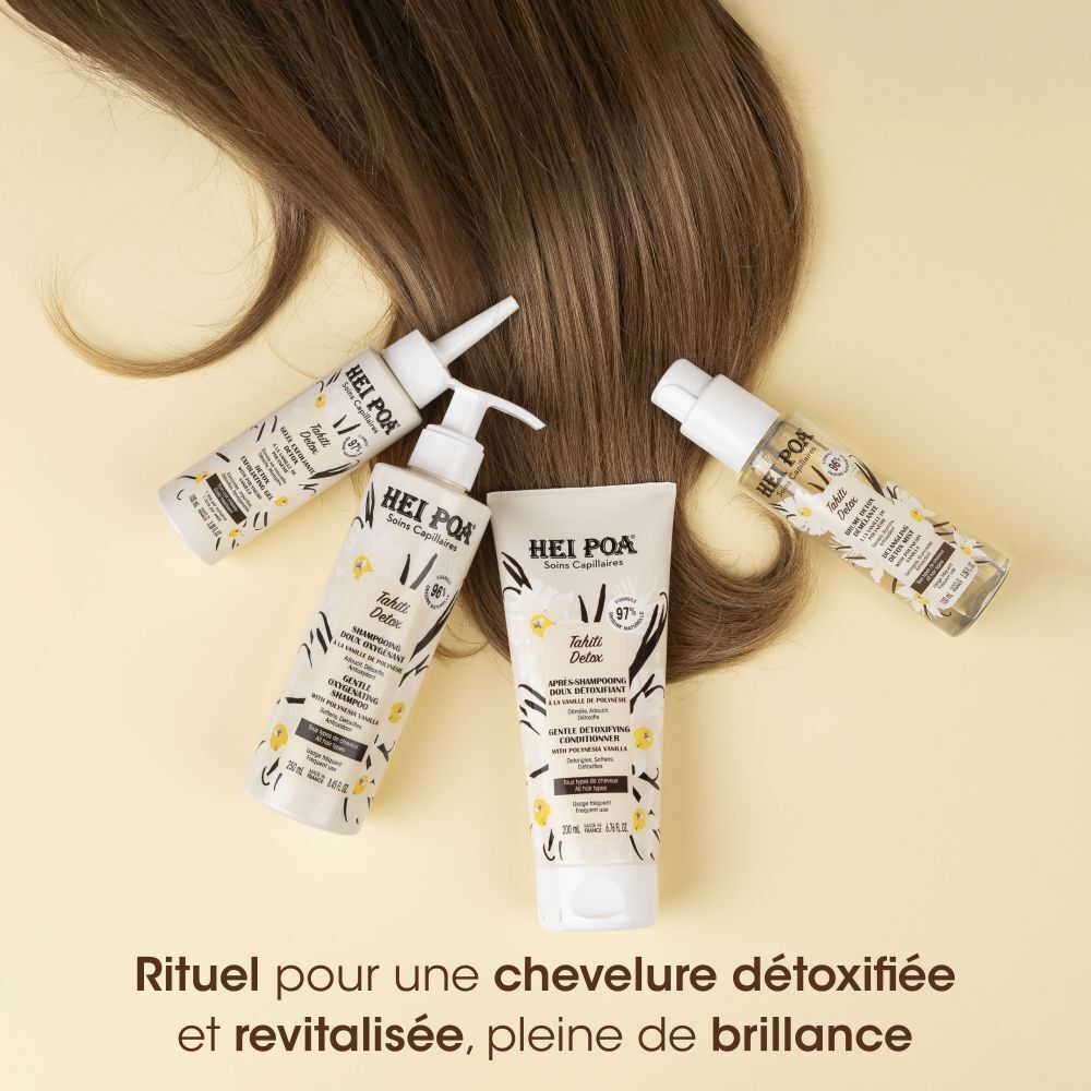 Plusieurs produits de la gamme Hei Poa Tahiti Detox, flacons et tube, sur une chevelure.