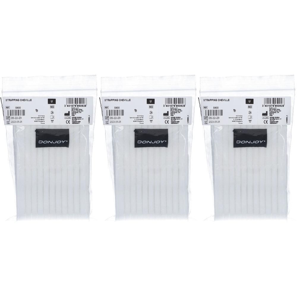 Drie verpakkingen witte enkelbandjes, maat M, met DonJoy logo.