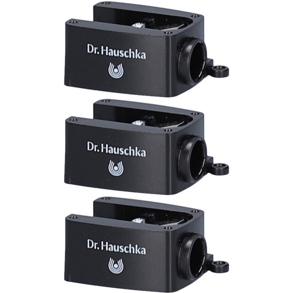 Trois taille-crayons noirs avec le logo et le nom Dr. Hauschka.