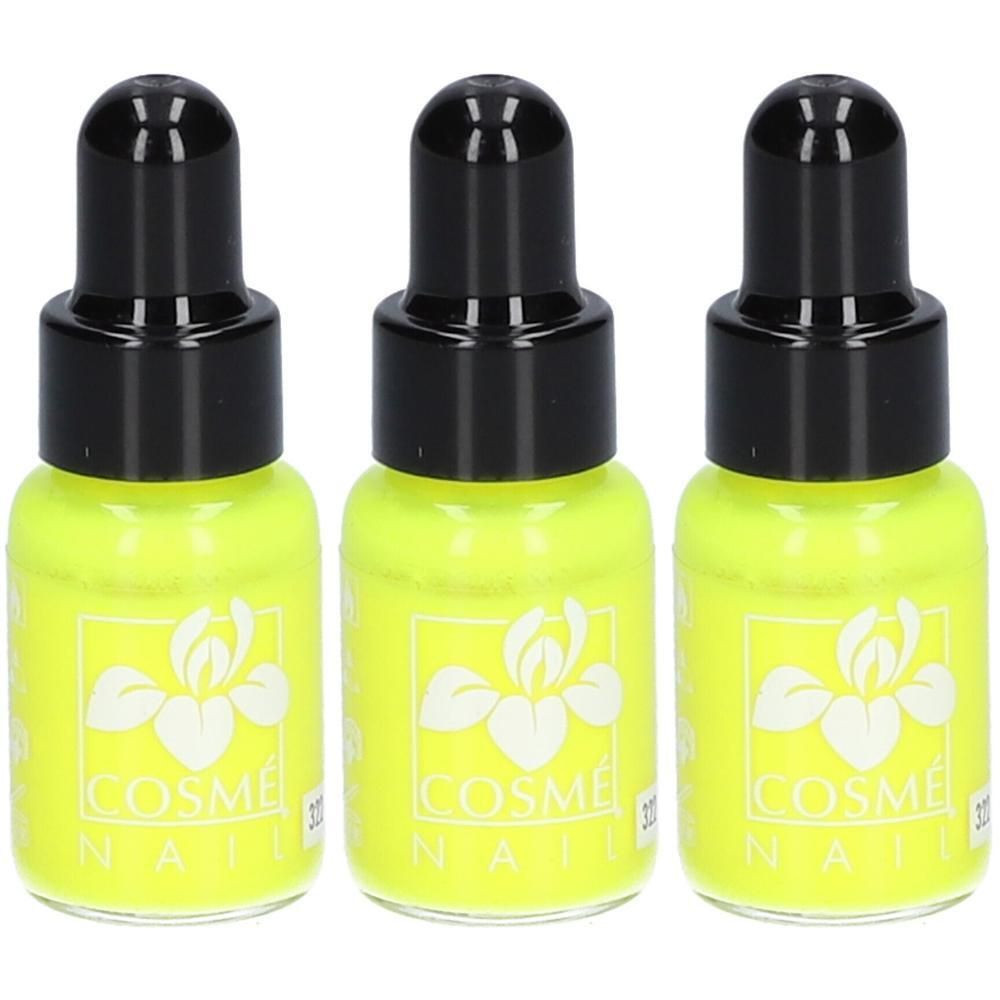 Drie flesjes felgeel nagellak met zwarte druppeldopjes en wit bloemenmotief.