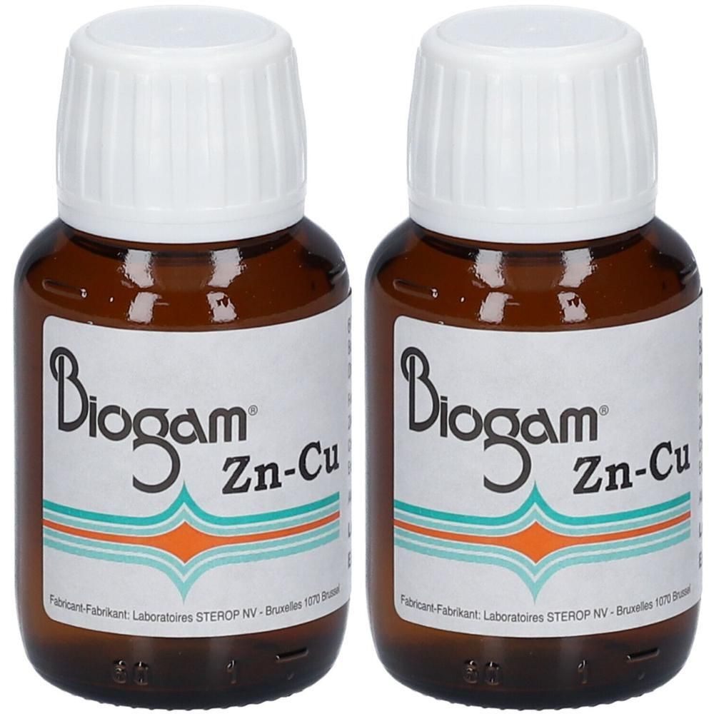 Twee bruine glazen flesjes met witte schroefdoppen, gelabeld "Biogam Zn-Cu".