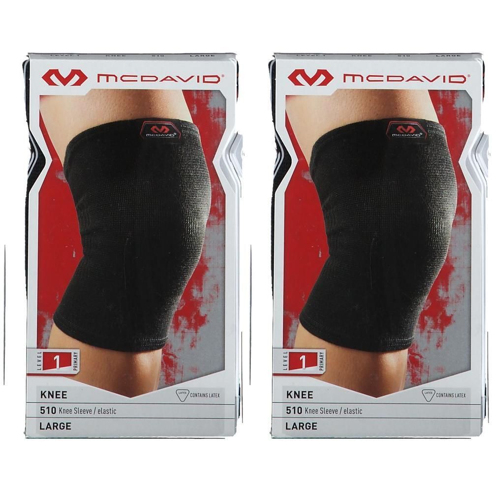 Deux genouillères élastiques McDavid 510 noires, taille L, présentées en emballage.