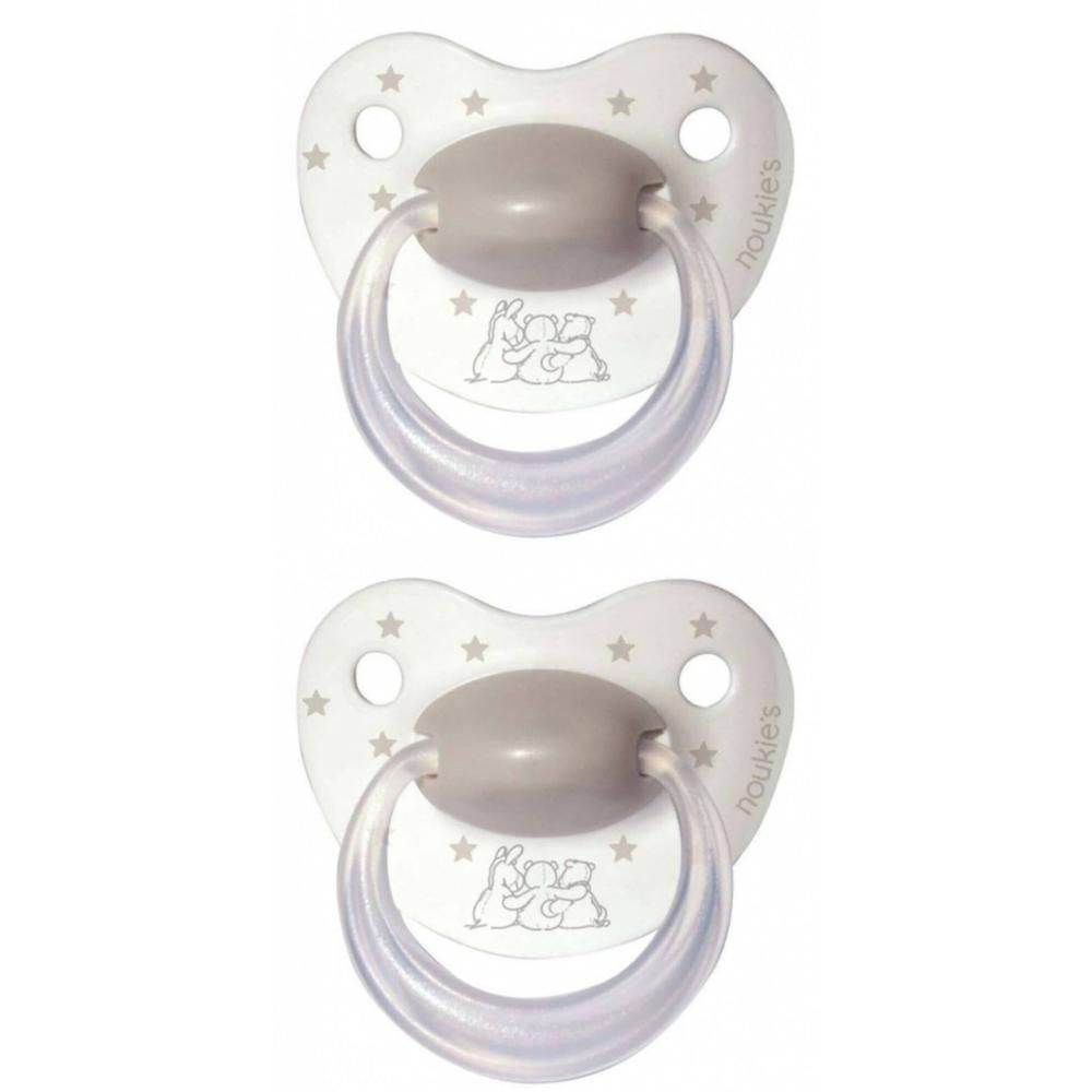 Deux sucettes blanches à étoiles grises et motif lapin. La poignée est transparente.