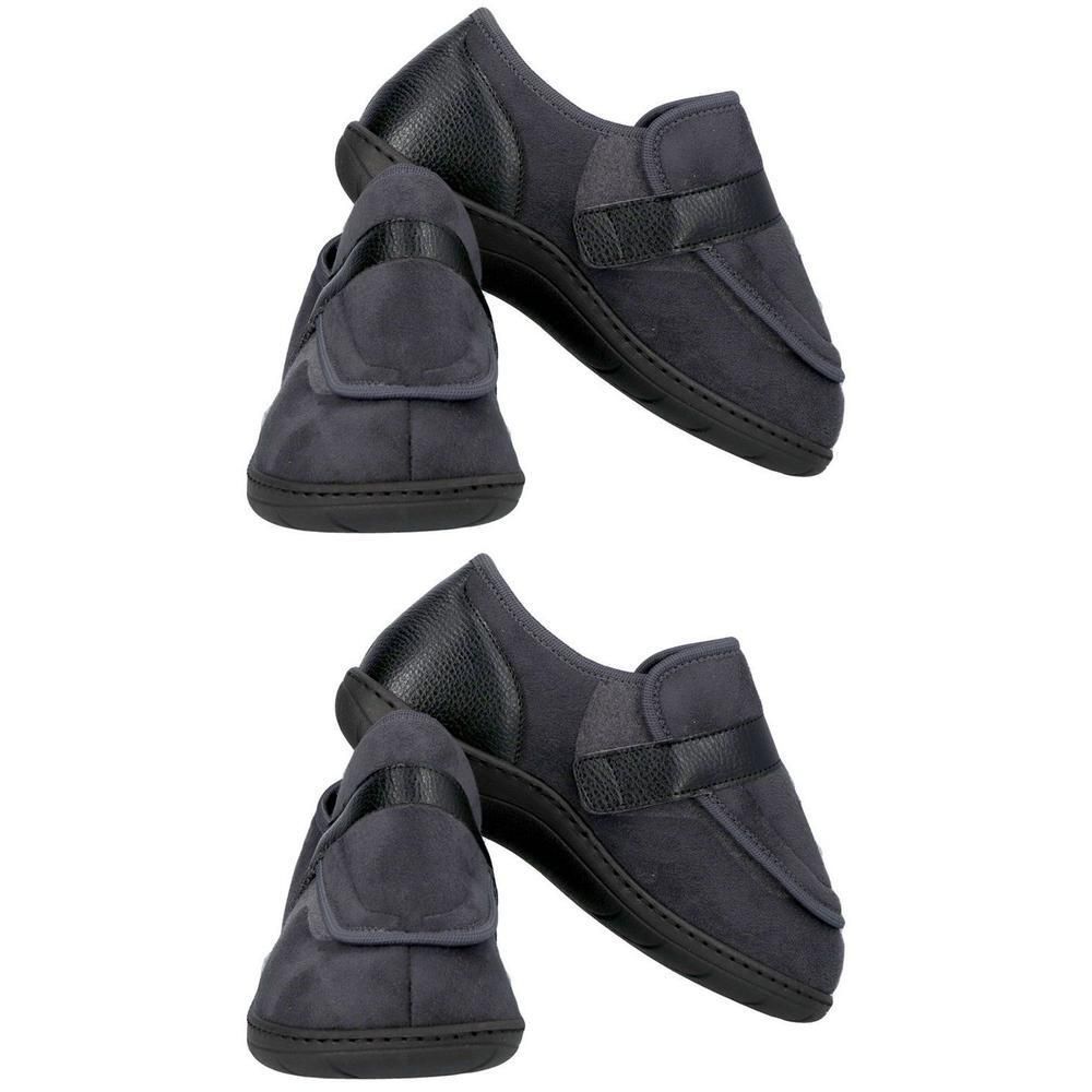 Twee grijze comfortabele schoenen met klittenbandsluiting en zwarte lederen accenten.