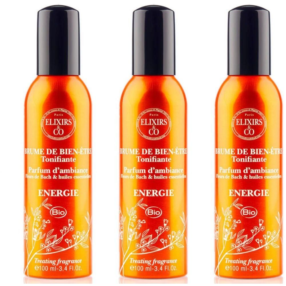 Drie oranje spuitflessen met zwarte dop, etiket met "Elixirs & Co" en "Energie".