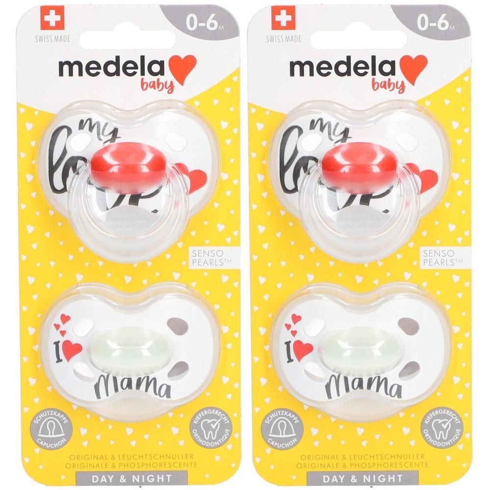 Twee Medela fopspenen 0-6 maanden met pinguïnmotief en blauwe accenten.