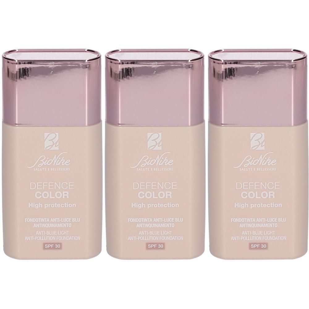 Drie BioNike Defence Color High Protection Foundations in zandkleur met SPF 30.