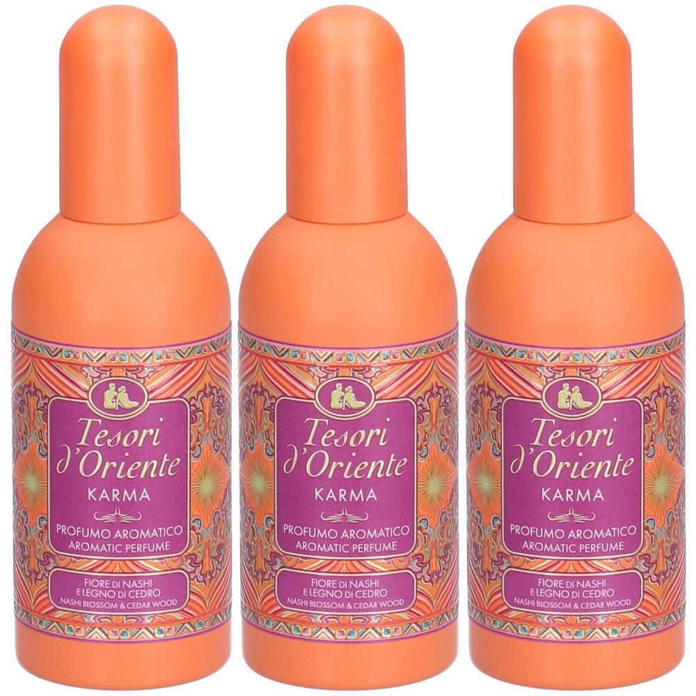 Drie flessen Tesori D'Oriente Karma parfum met oranje doppen en paarse etiketten.
