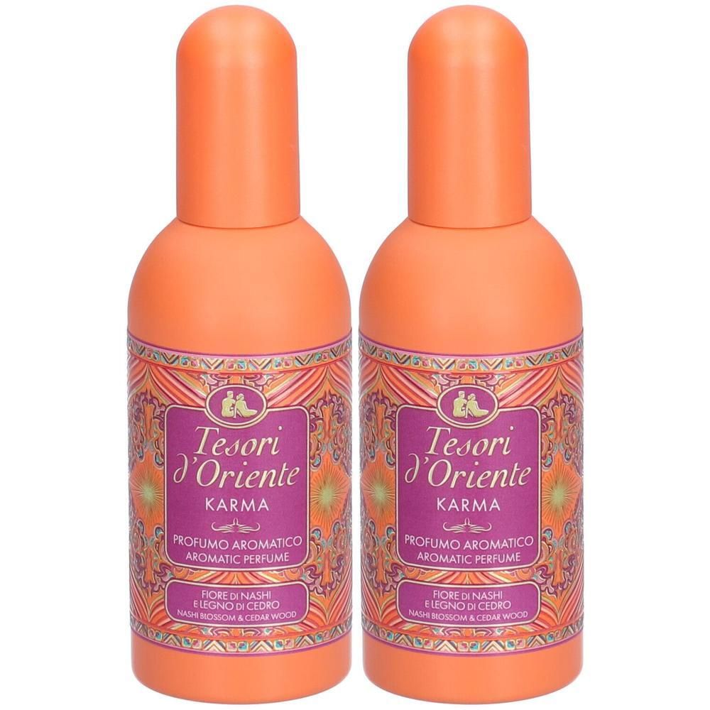 Twee flessen Tesori D'Oriente Karma parfum met oranje doppen en versierde etiketten.
