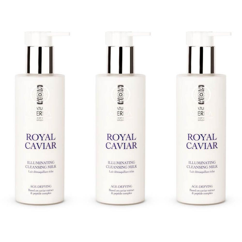 Trois flacons pompe blancs avec des accents argentés, étiquetés 'ROYAL CAVIAR ILLUMINATING CLEANSING MILK'.