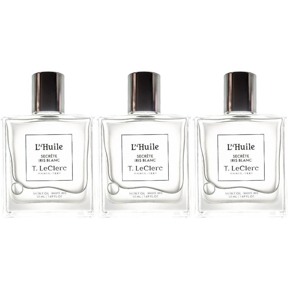 Drie flacons T. LeClerc L'Huile Secrète Iris Blanc met heldere olie en zilverkleurige doppen.