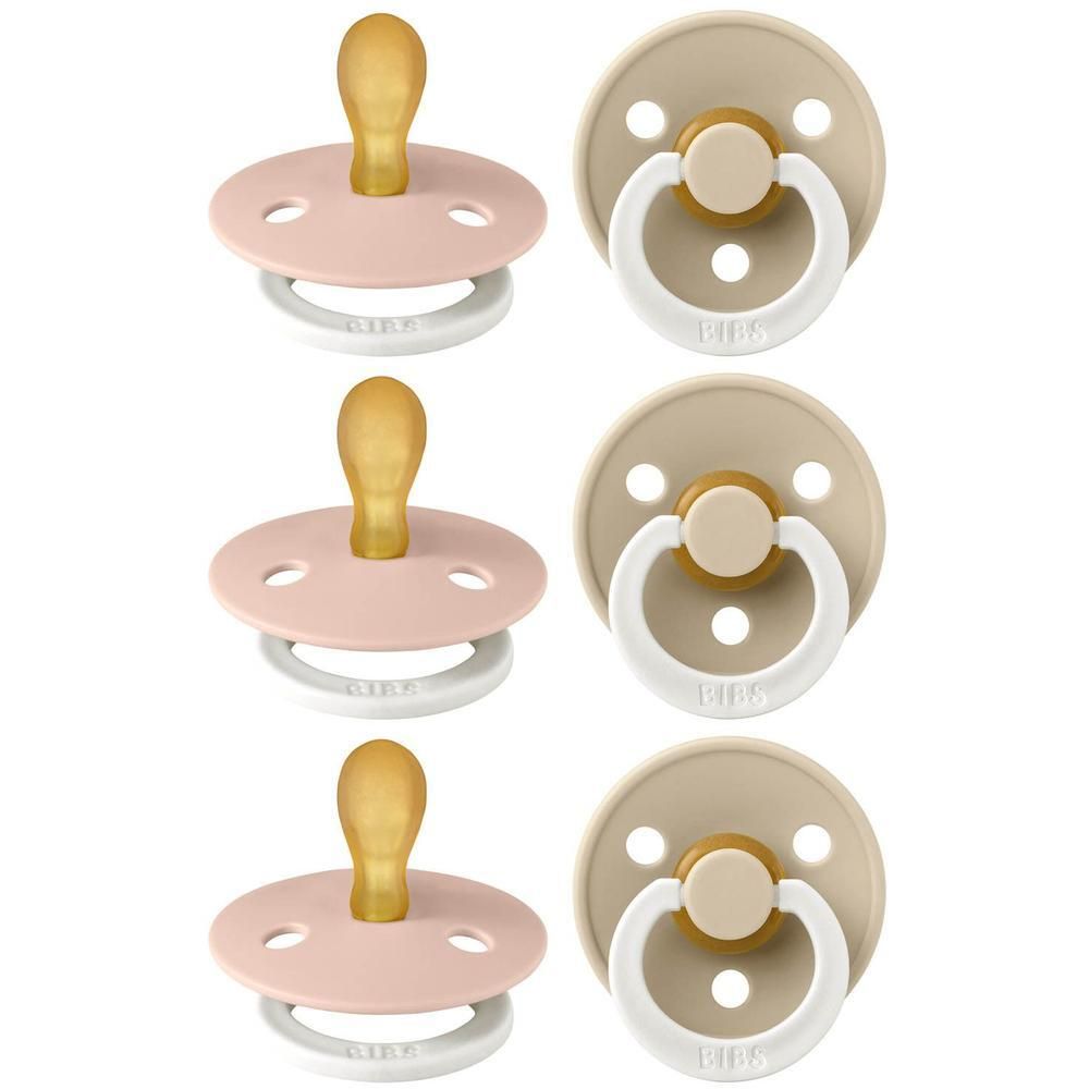 Drie roze en drie beige BIBS spenen met lichte greep en witte ring.