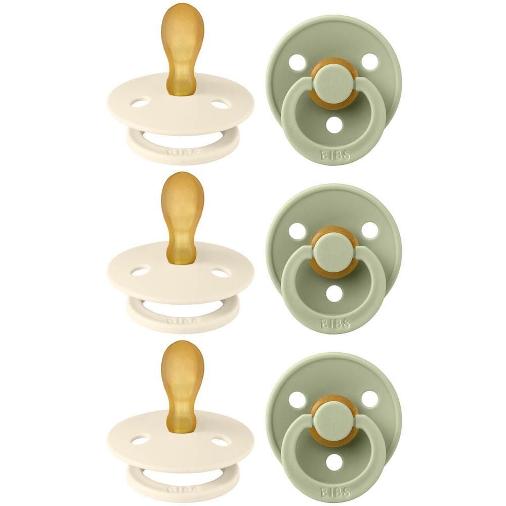 Trois sucettes beige clair et trois vert pâle avec bouclier rond et tétine en caoutchouc naturel.
