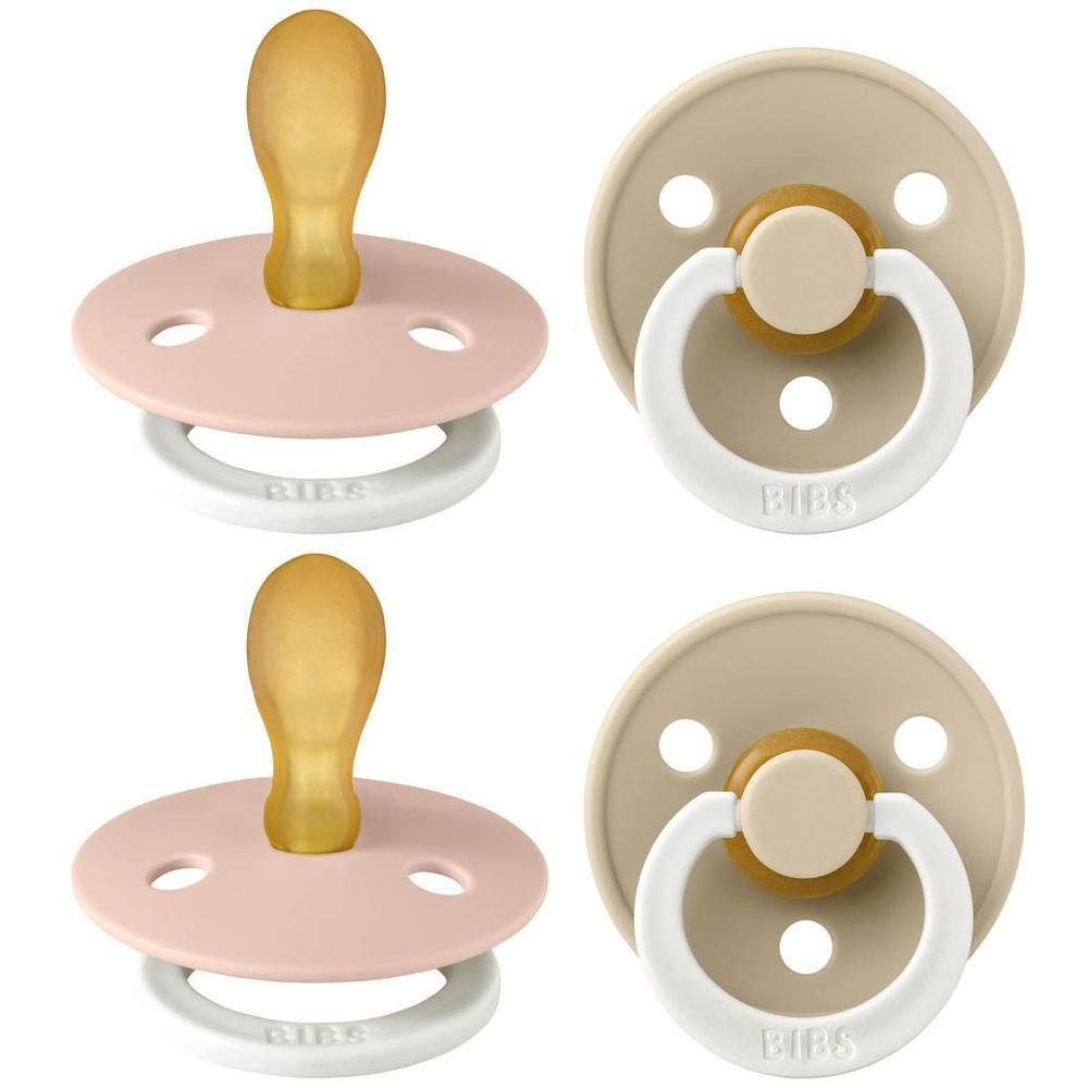 Twee BIBS fopspenen in roze en beige met natuurrubberen speen en witte ring.