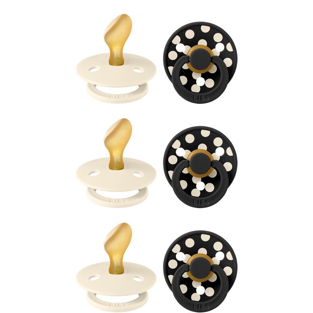Trois sucettes crème et trois sucettes noires à pois, avec tétine anatomique.
