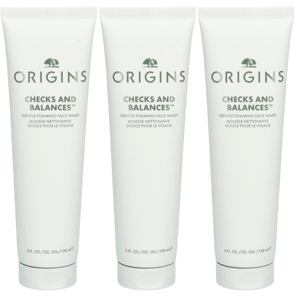 Trois tubes blancs de nettoyant visage moussant doux Origins Checks and Balances, 150 ml chacun.